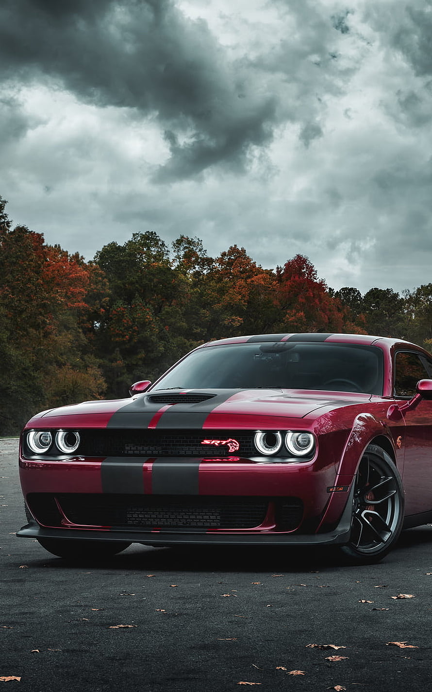 Red Dodge Challenger SRT Hellcat Widebody with Black Racing Stripes Under Stormy Autumn Sky HD phone wallpaper