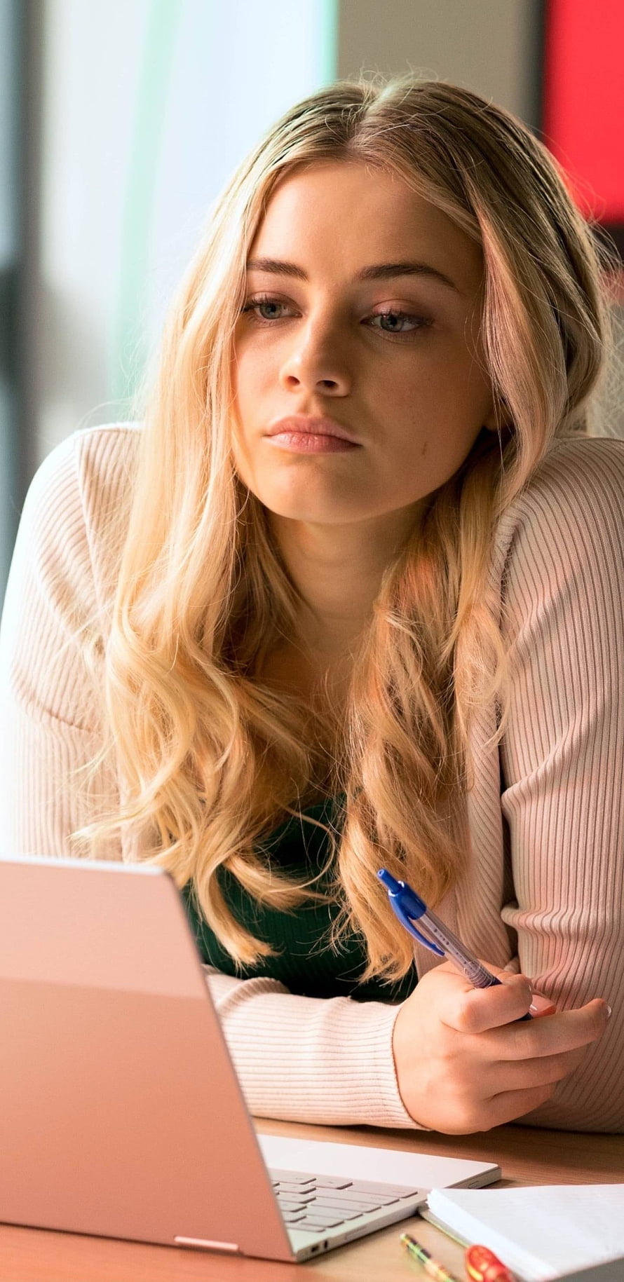 Josephine Langford Focused at Laptop with Pen in Soft Light HD phone wallpaper
