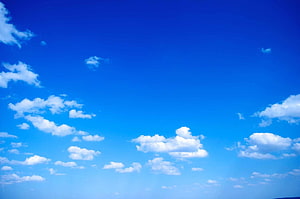 Serene Blue Sky With Fluffy White Clouds Scattered Across Bright Horizon HD wallpaper