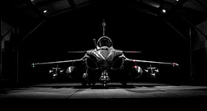 Front View of Eurofighter Typhoon Fighter Jet in Dark Hangar HD wallpaper