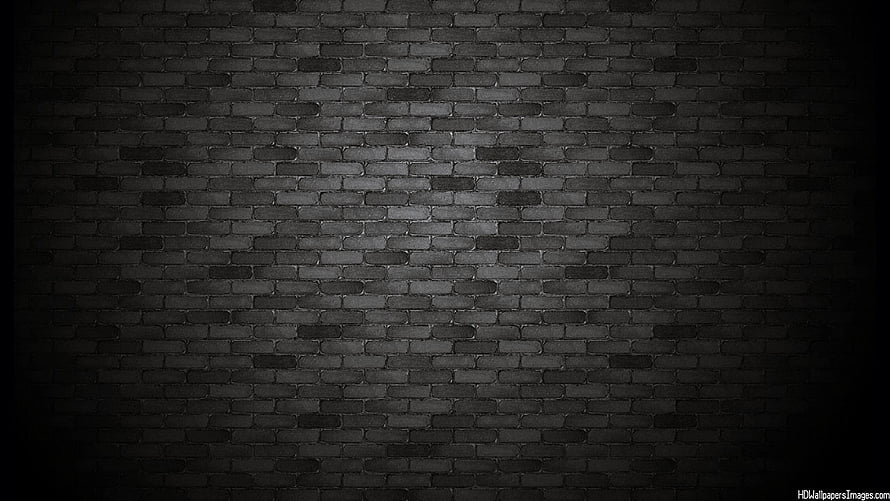 Dark Black Brick Wall Texture with Dramatic Vignette and Moody Industrial Atmosphere HD wallpaper