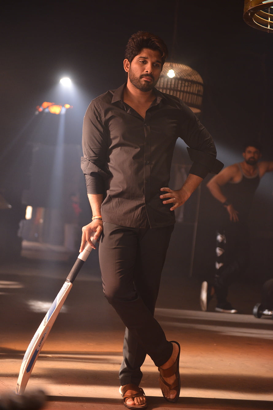 Allu Arjun in Black Shirt Holding Cricket Bat in Dimly Lit Gym Setting HD phone wallpaper