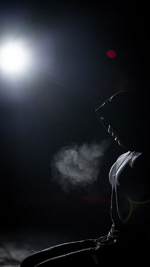Dark Hooded Figure Silhouette With Smoke And Bright Light HD phone wallpaper