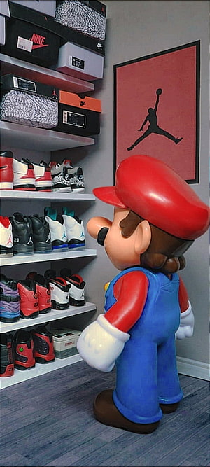 Mario Statue Admiring Jordan Sneaker Collection in Shoe Room HD phone wallpaper