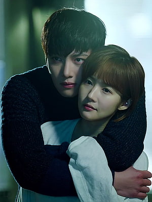 Healer Korean Drama Still: Intimate Embrace Between Lead Characters in Moody Cinematic Lighting HD phone wallpaper