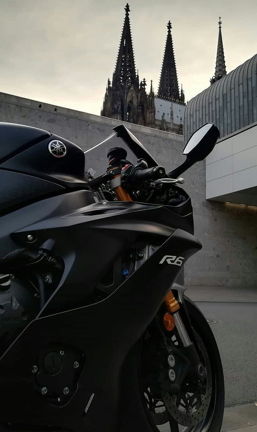 Matte Black Yamaha R6 Superbike Parked Before Gothic Cathedral Spires HD phone wallpaper