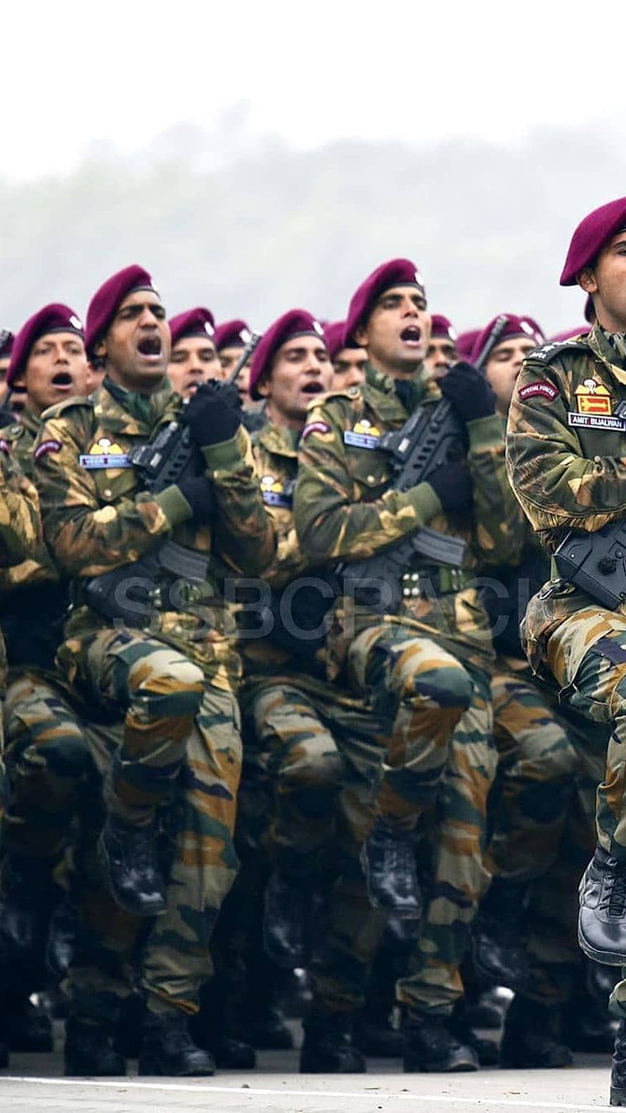 Indian Army soldiers in camouflage uniforms and maroon berets marching in formation HD phone wallpaper