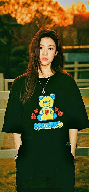 High quality portrait of a young woman wearing a black t-shirt with a colorful teddy bear graphic and heart necklace, Go Yoon Jung HD phone wallpaper