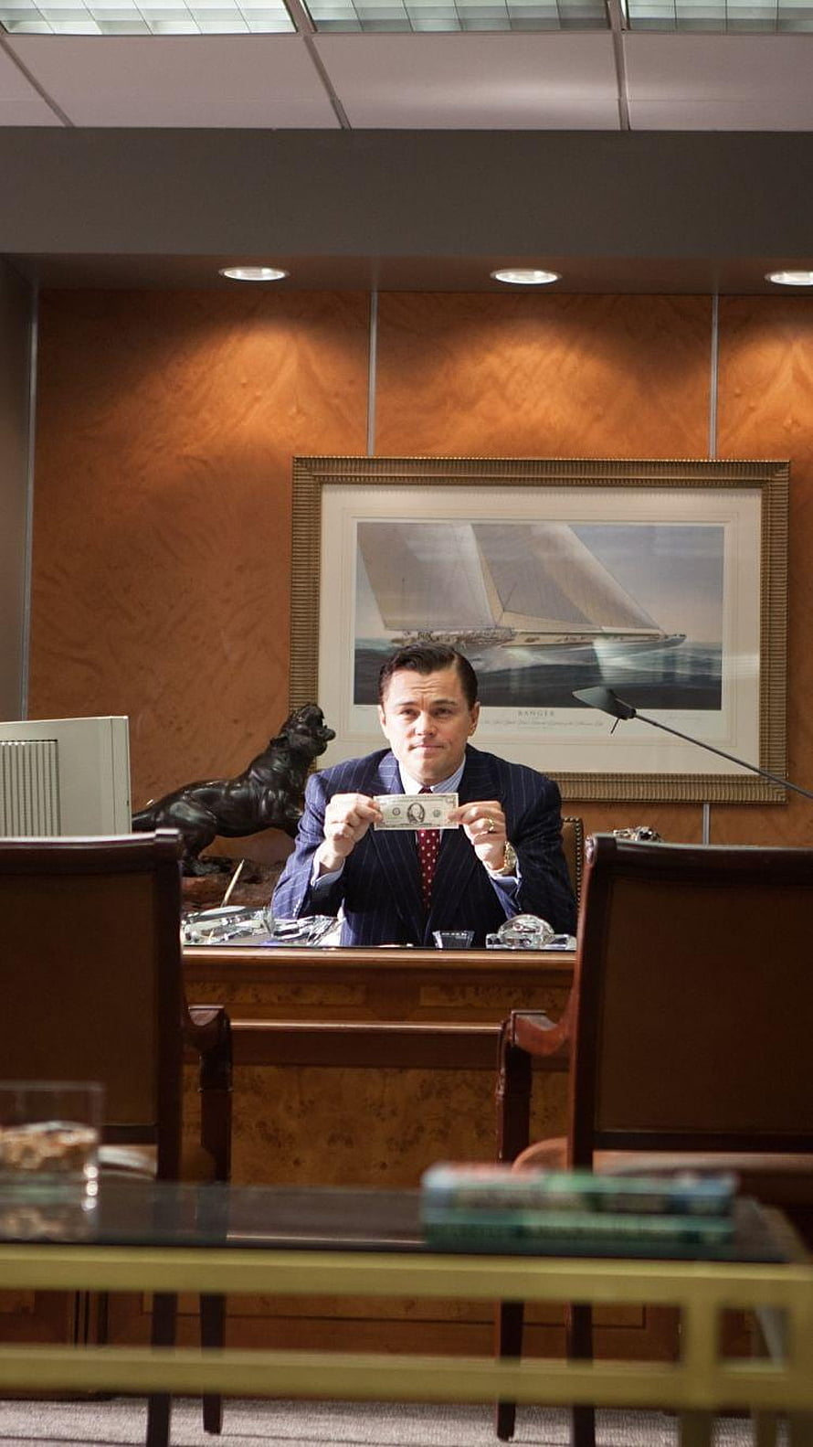 Jordan Belfort holding dollar bill in office from The Wolf of Wall Street HD phone wallpaper