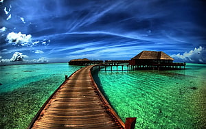 Tropical Overwater Bungalows Connected by Wooden Boardwalk in Turquoise Lagoon HD wallpaper