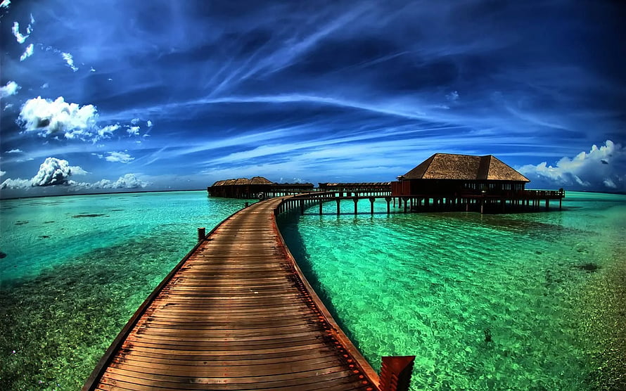 Tropical Overwater Bungalows Connected by Wooden Boardwalk in Turquoise Lagoon HD wallpaper