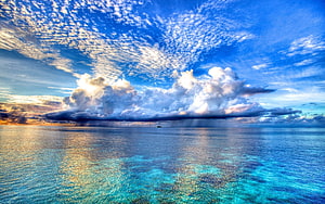Stunning Tropical Ocean View With Dramatic Clouds And Clear Turquoise Water HD wallpaper