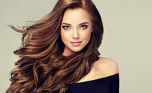 Studio Portrait of a Brunette Model with Flowing Hair and Blue Eyes HD wallpaper