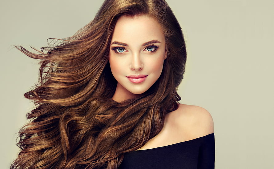 Studio Portrait of a Brunette Model with Flowing Hair and Blue Eyes HD wallpaper