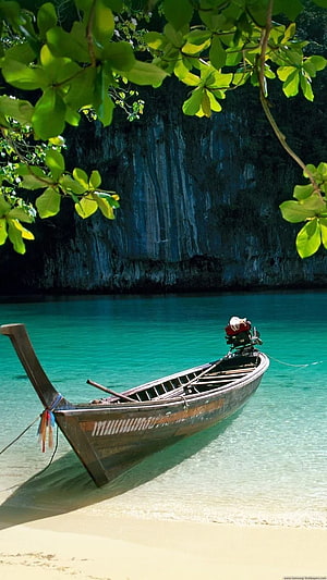 Traditional Thai Longtail Boat Anchored in Turquoise Lagoon with Limestone Cliffs HD phone wallpaper