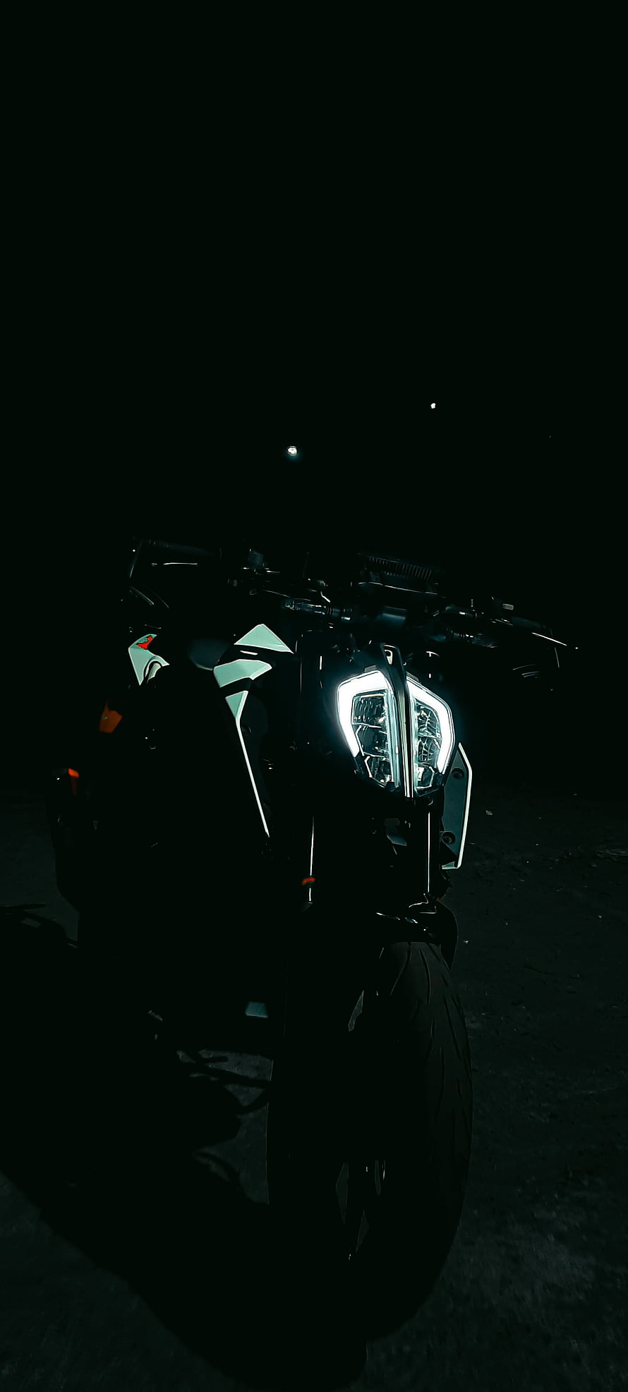 Dramatic Night Shot of a Motorcycle with Glowing LED Headlights in Darkness HD phone wallpaper