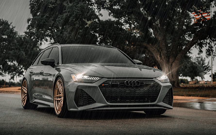 Audi RS6 Avant C8 in Gray with Bronze Wheels on a Rainy Road HD wallpaper