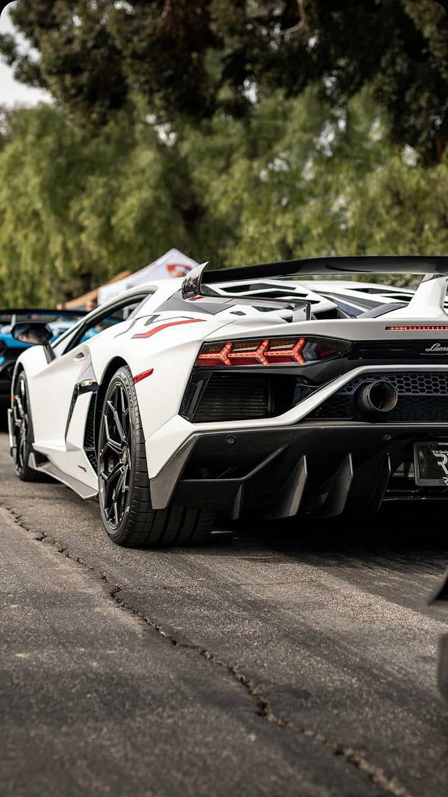 Rear Three-Quarter View of a White Lamborghini Aventador SVJ with Carbon Fiber Diffuser HD phone wallpaper