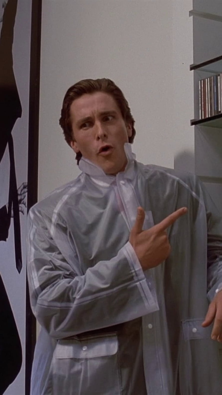 Patrick Bateman in American Psycho wearing a silver raincoat and pointing, Movie American Psycho, Patrick Bateman HD phone wallpaper