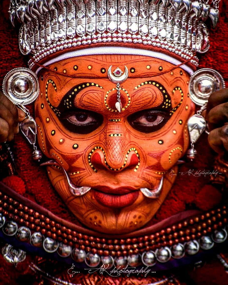 Traditional Kathakali Dance Makeup Portrait with Intricate Silver Jewelry and Crown HD phone wallpaper