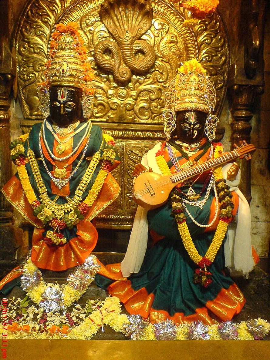 Ornate Vitthal and Rukmini Temple Deities Adorned in Traditional Garments and Jewelry HD phone wallpaper