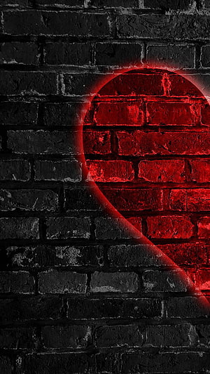 Glowing Red Heart Shape on Dark Textured Brick Wall HD phone wallpaper