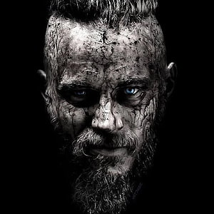Ragnar Lothbrok Dark Portrait with Intense Blue Eyes and Weathered Beard HD phone wallpaper