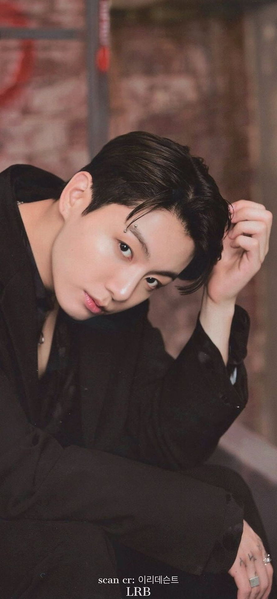 Stunning Portrait of Jungkook in Black Suit with Intense Gaze and Elegant Pose HD phone wallpaper