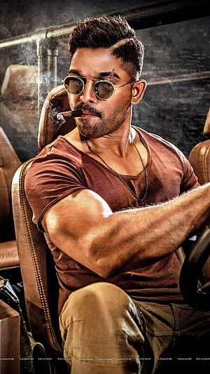 Allu Arjun in Pushpa The Rise wearing sunglasses and smoking a cigar while driving a car HD phone wallpaper