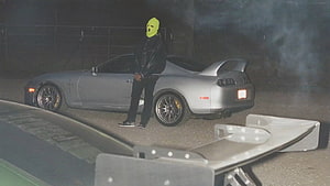 Travis Scott Jackboys Music Video Scene with Silver Nissan 300ZX and Yellow Mask HD wallpaper