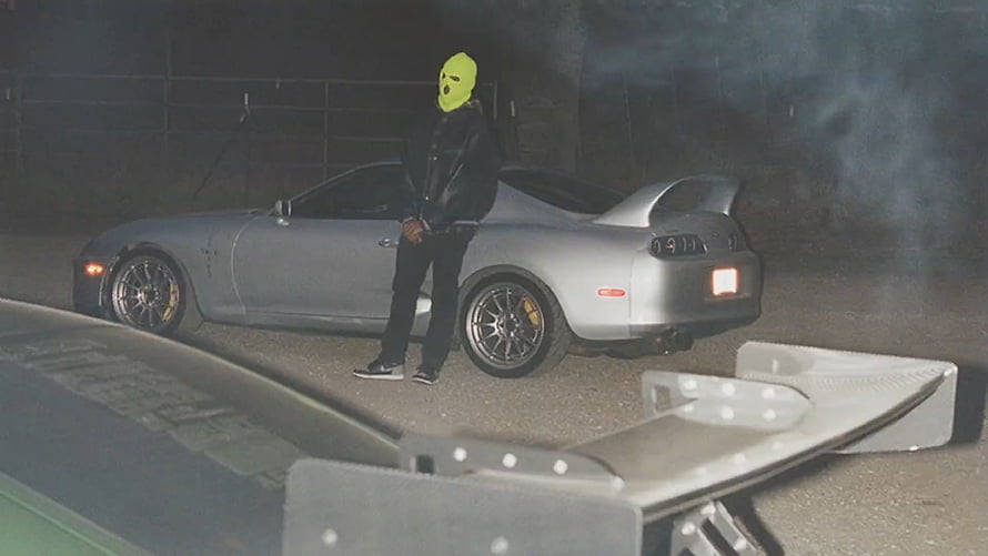 Travis Scott Jackboys Music Video Scene with Silver Nissan 300ZX and Yellow Mask HD wallpaper