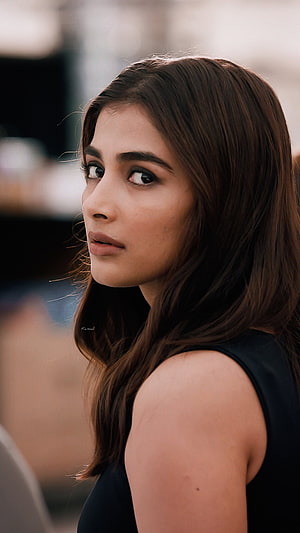 Pooja Hegde Close-Up Portrait With Long Brown Hair And Intense Gaze HD phone wallpaper