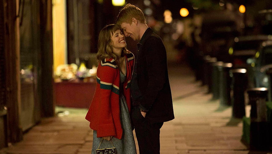 About Time Movie Scene: Couple Sharing a Tender Moment on a City Street at Night HD wallpaper