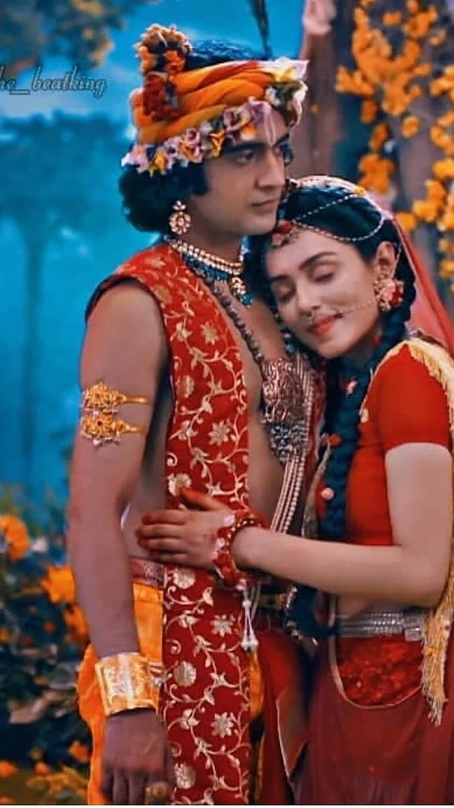 Radha Krishna in Traditional Indian Attire with Floral Headpieces and Jewelry HD phone wallpaper
