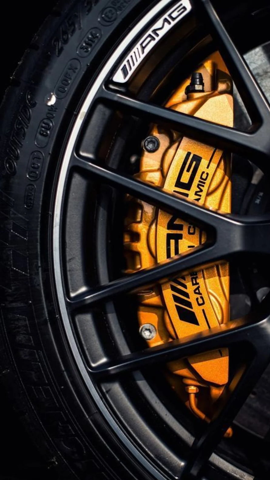 Close-up of Mercedes-AMG S-Class Ceramic Brake Caliper and Black Multi-Spoke Alloy Wheel HD phone wallpaper