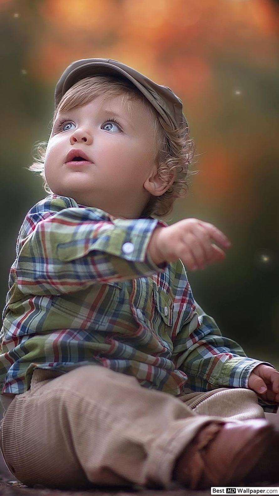 Cute Toddler Boy in Plaid Shirt and Cap Looking Up with Wonder HD phone wallpaper
