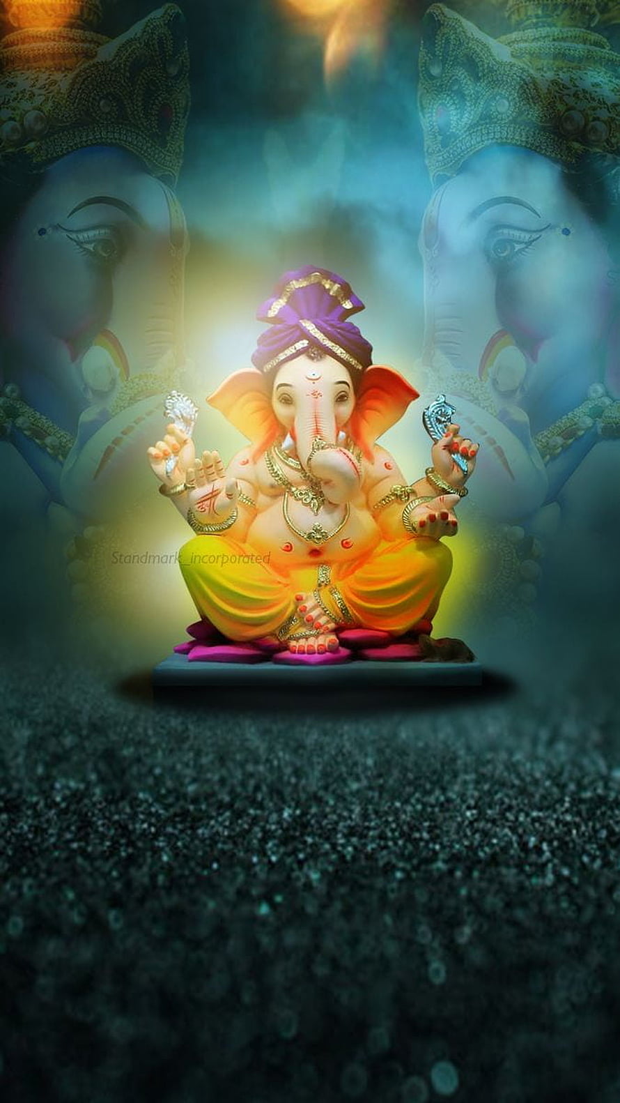 Ganesha Idol with Glowing Background and Ethereal Atmosphere HD phone wallpaper