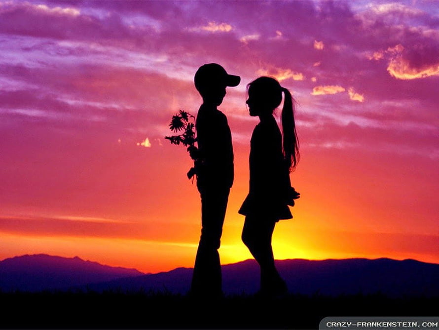 Silhouette of a Boy Giving Flowers to a Girl at Sunset HD wallpaper