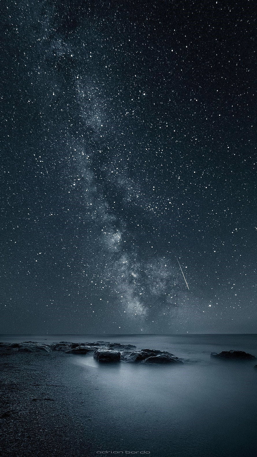 Milky Way Galaxy Over Calm Ocean With Rocks And Shooting Star HD phone wallpaper