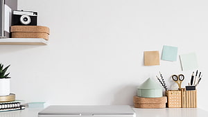 Minimalist White Home Office Desk Setup With Vintage Camera And Stationery HD wallpaper