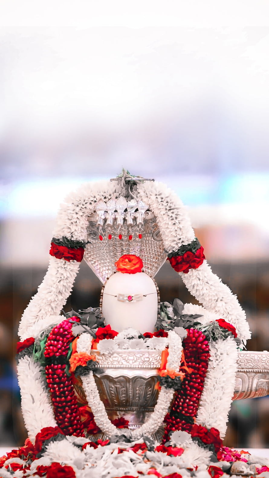 Decorated Shiva Lingam with White and Red Flower Garlands HD phone wallpaper
