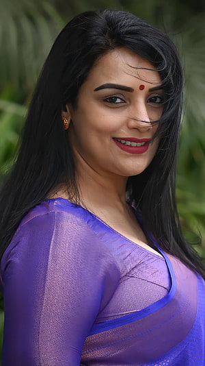 Portrait of Indian Actress Keerthy Suresh Wearing a Purple Saree with a Red Bind HD phone wallpaper