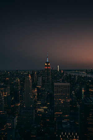 Empire State Building Illuminates the New York City Skyline at Dusk HD phone wallpaper