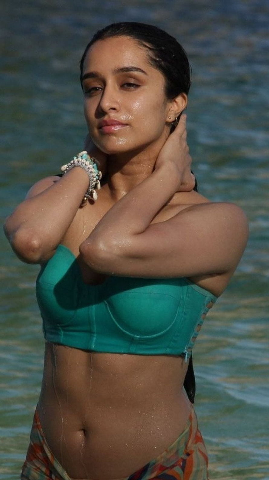 Shraddha Kapoor in a Teal Bikini Top Standing in Ocean Water HD phone wallpaper