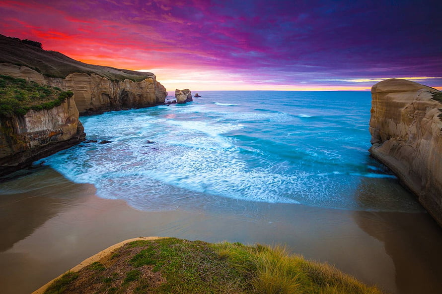 Dramatic Sunset at the Twelve Apostles with Vibrant Purple and Orange Sky Over Ocean Cliffs HD wallpaper