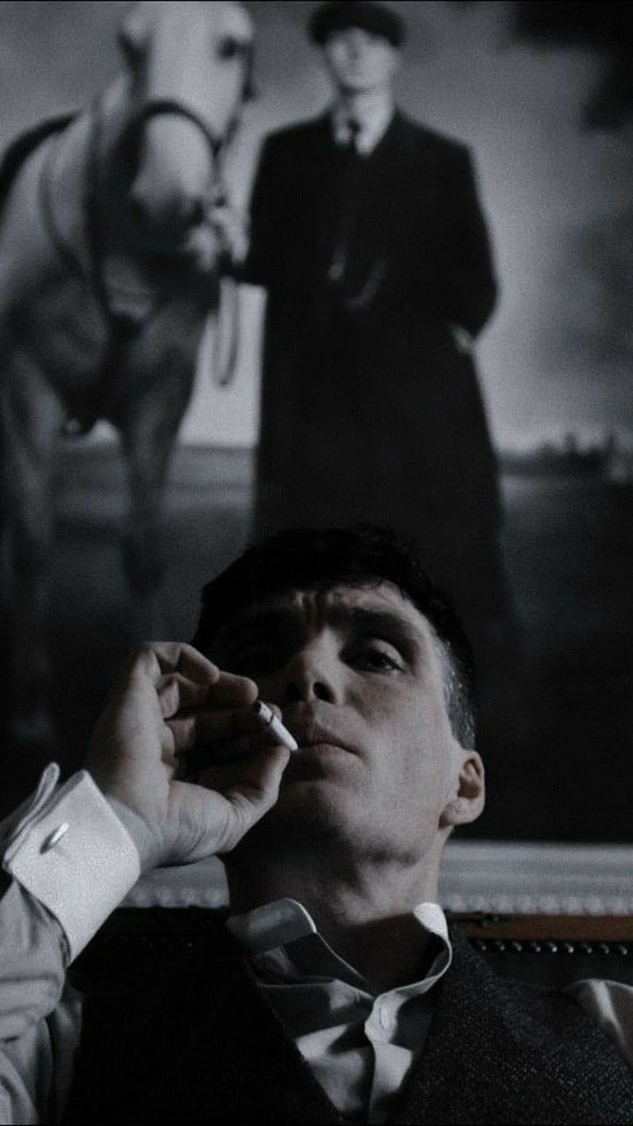 Thomas Shelby smoking cigarette with horse portrait background in black and white HD phone wallpaper