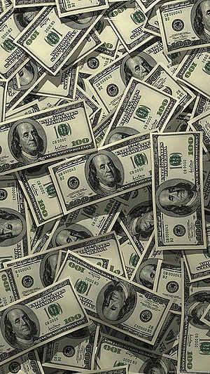 Scattered pile of one hundred dollar bills with Benjamin Franklin portrait HD phone wallpaper