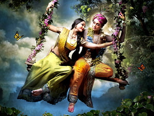 Radha and Krishna on a Flower-Adorned Swing in a Lush Garden HD wallpaper