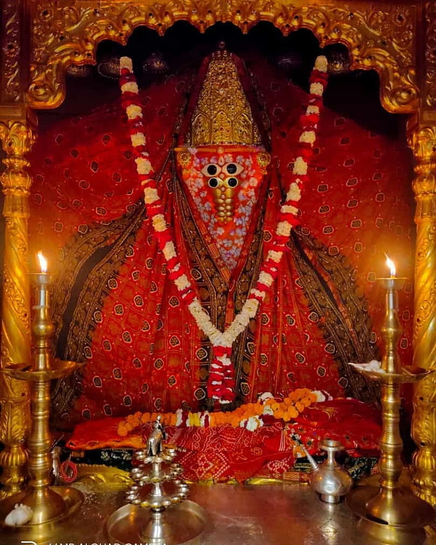 Kamakhya Temple Goddess Kamakhya Idol with Red Saree and Flower Garland HD phone wallpaper