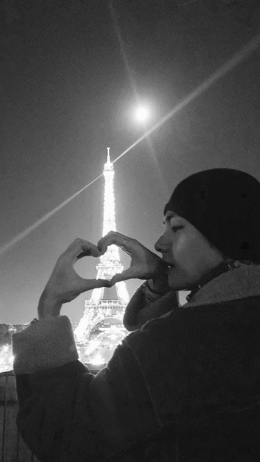 Kim Taehyung Making a Heart Gesture in Front of the Eiffel Tower at Night HD phone wallpaper
